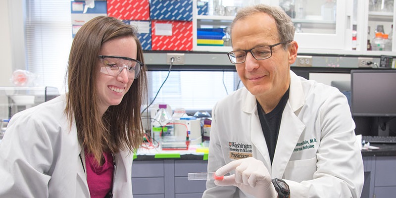 Geroscientist Samuel Klein, MD, shown here with a student is leading the drive to bring NAD-boosting NMN into the clinic.